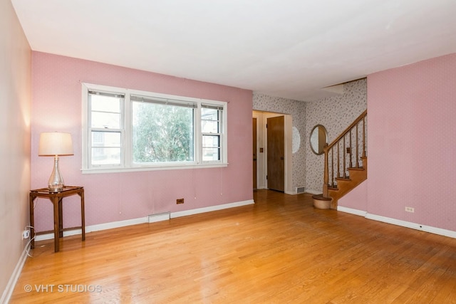 spare room with hardwood / wood-style flooring