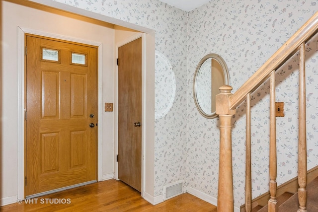 foyer entrance with wood-type flooring