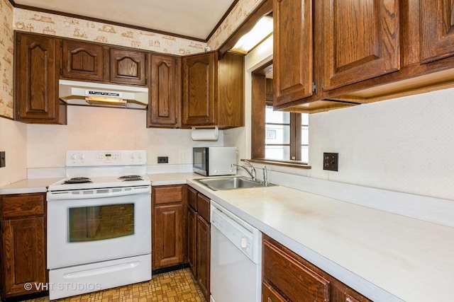 kitchen featuring white appliances and sink