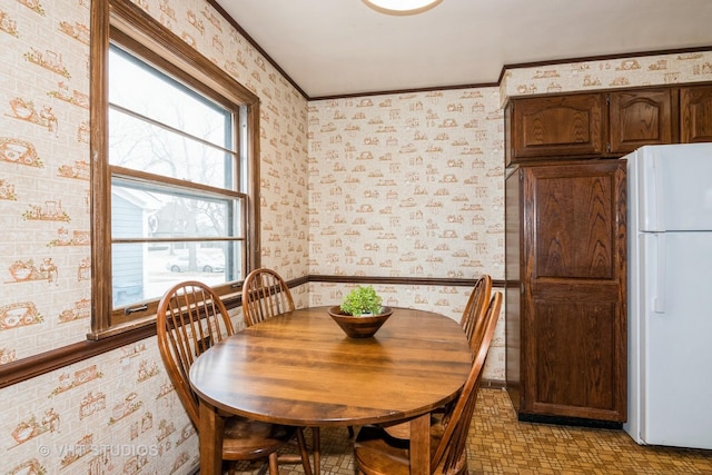 dining room featuring crown molding