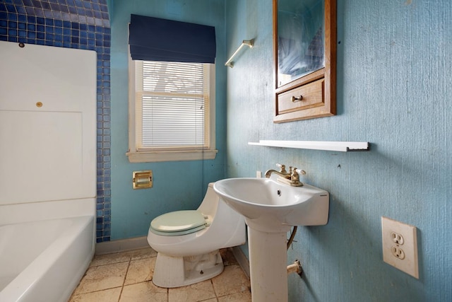 bathroom with tile patterned floors and toilet