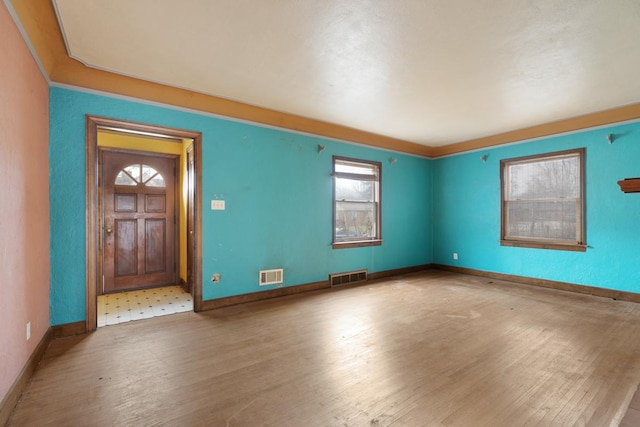 entryway with hardwood / wood-style flooring