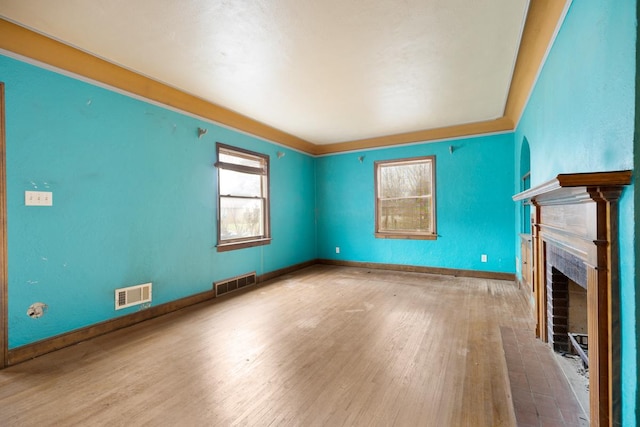 unfurnished living room featuring hardwood / wood-style floors