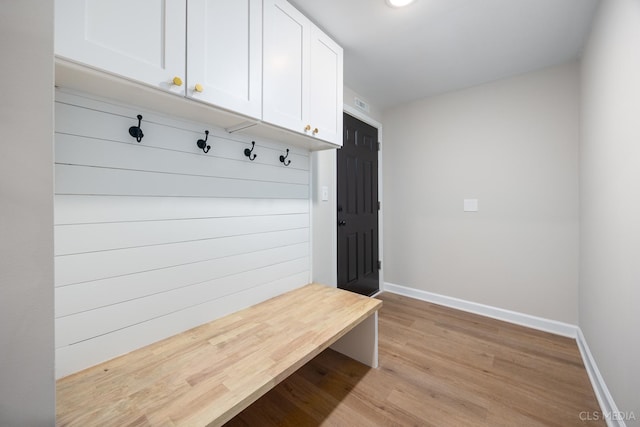 mudroom with light hardwood / wood-style floors