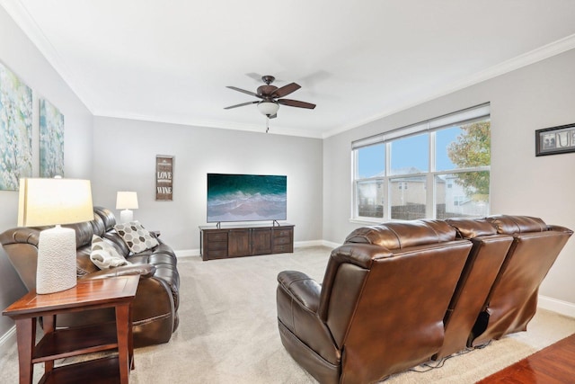 carpeted living room with crown molding and ceiling fan