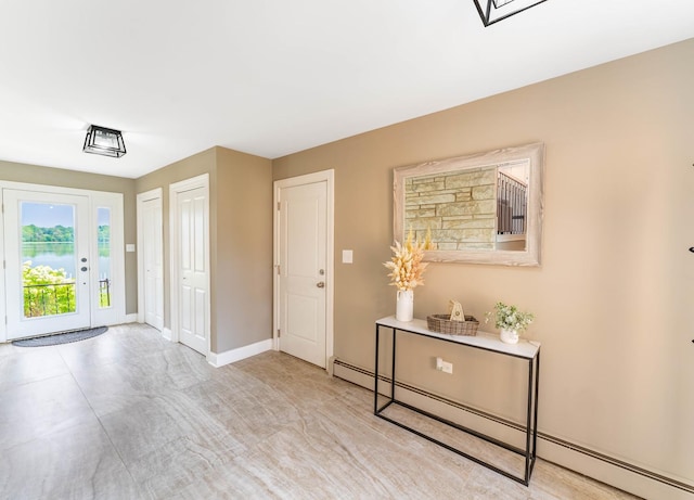 entrance foyer featuring a baseboard heating unit