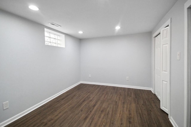 basement with dark wood-type flooring