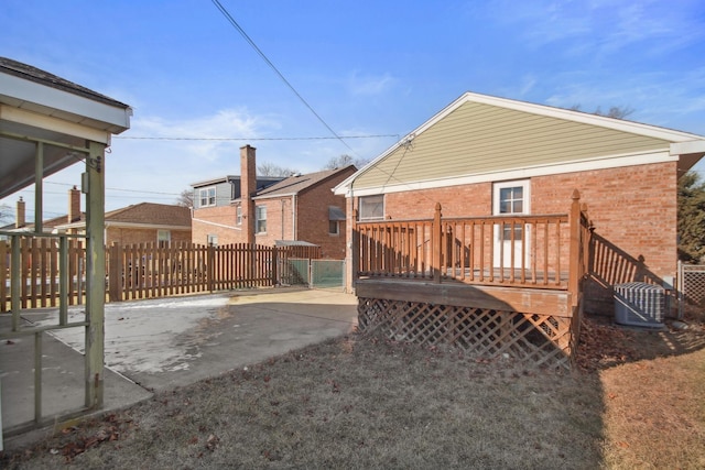 view of yard with cooling unit and a wooden deck