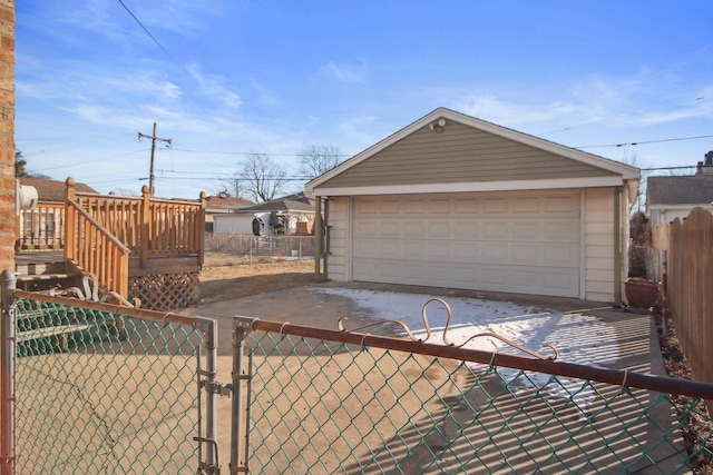 exterior space featuring a garage and an outdoor structure