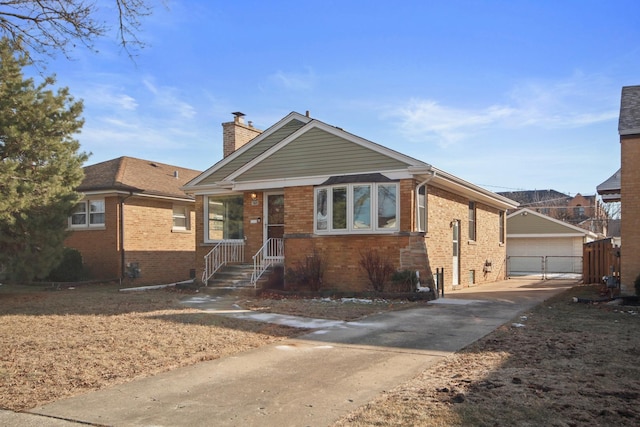 view of front facade with a garage and an outdoor structure