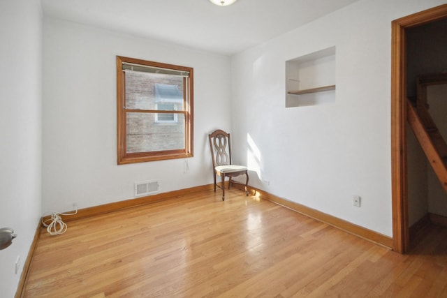 spare room with light hardwood / wood-style floors