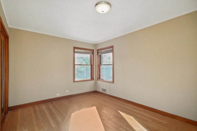 unfurnished room featuring light hardwood / wood-style floors