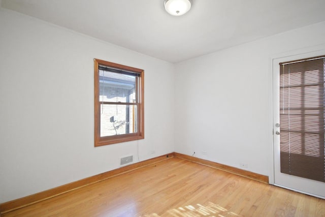 unfurnished room with light hardwood / wood-style floors