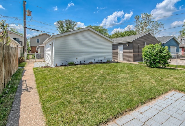 view of home's exterior featuring an outdoor structure and a lawn