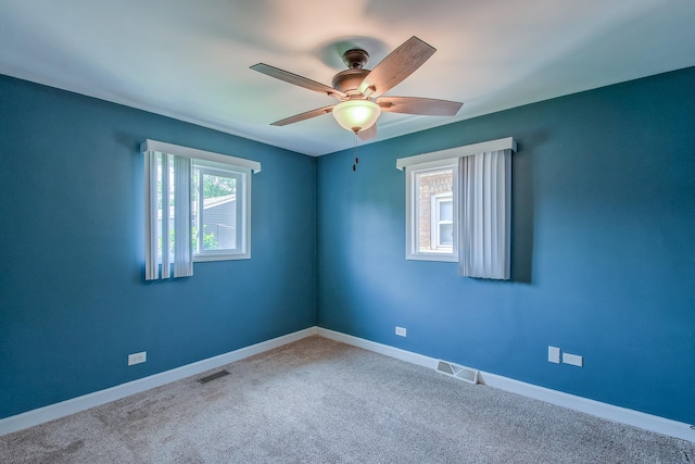 carpeted empty room with ceiling fan