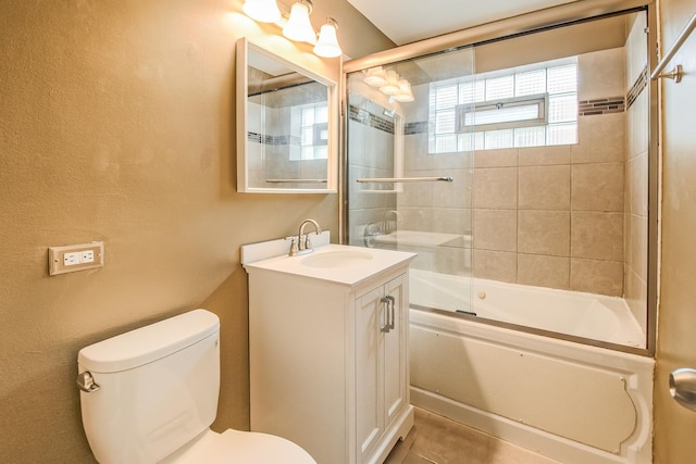 full bathroom with vanity, enclosed tub / shower combo, and toilet