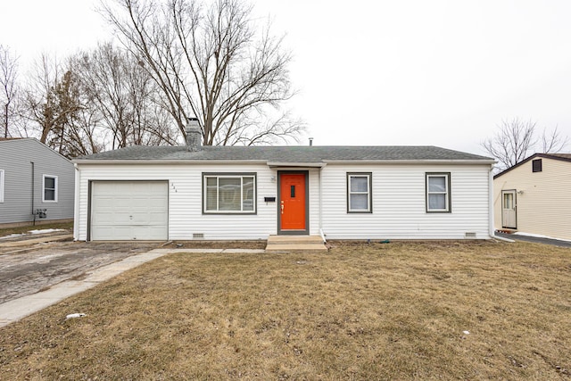 ranch-style house featuring a garage and a front lawn