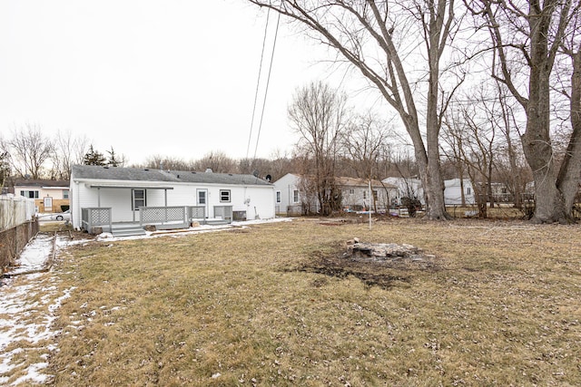 rear view of house with a lawn