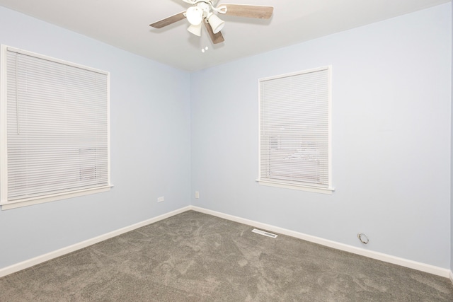 carpeted empty room featuring ceiling fan