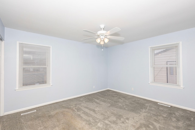 spare room with carpet floors and ceiling fan