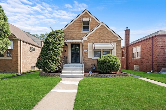 view of front of home with a front yard