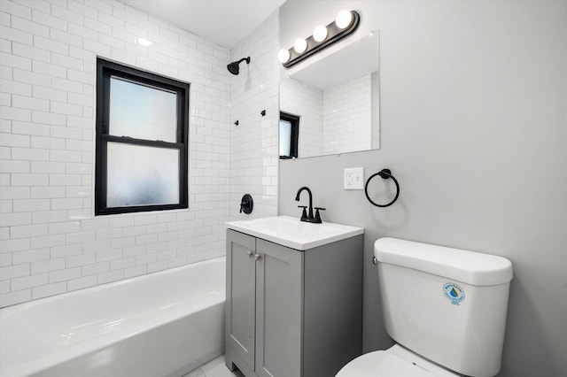 full bathroom with vanity, toilet, and tiled shower / bath