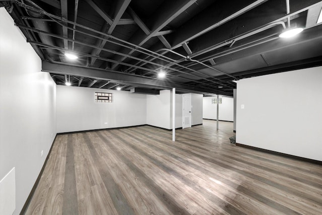 basement featuring wood-type flooring