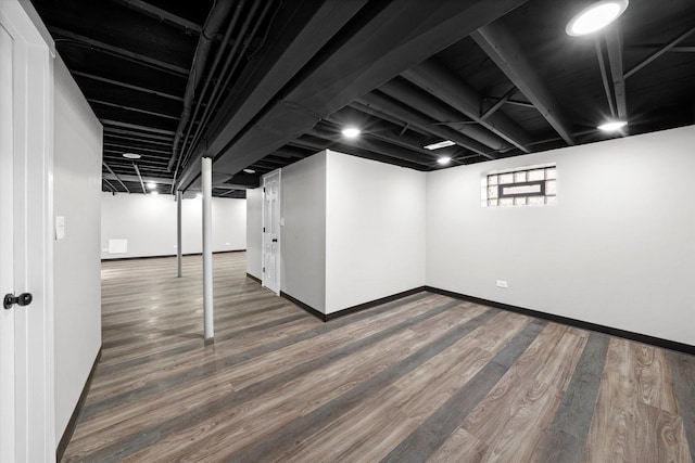 basement featuring dark wood-type flooring