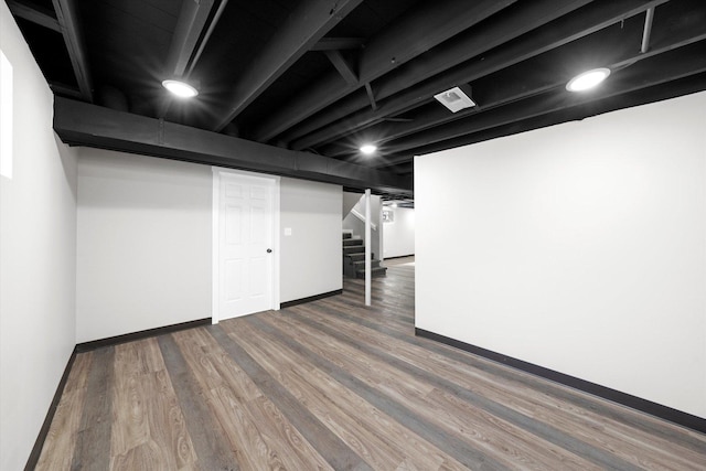 basement featuring hardwood / wood-style flooring