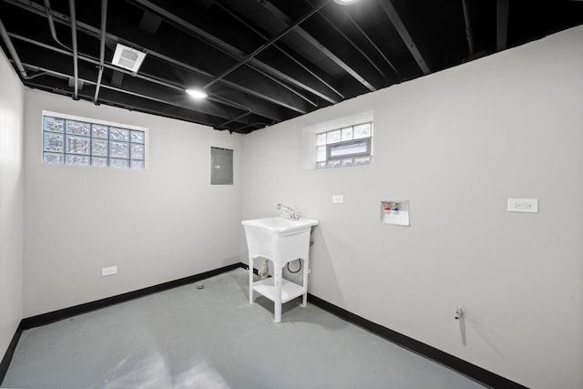 laundry area featuring sink, hookup for a washing machine, and electric panel