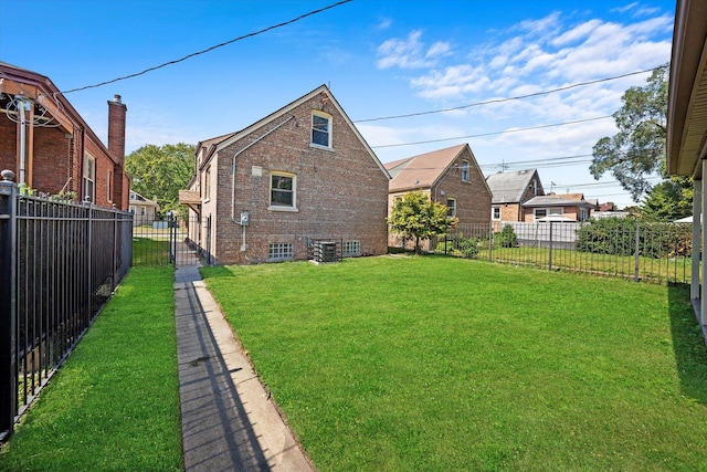 rear view of property featuring a yard