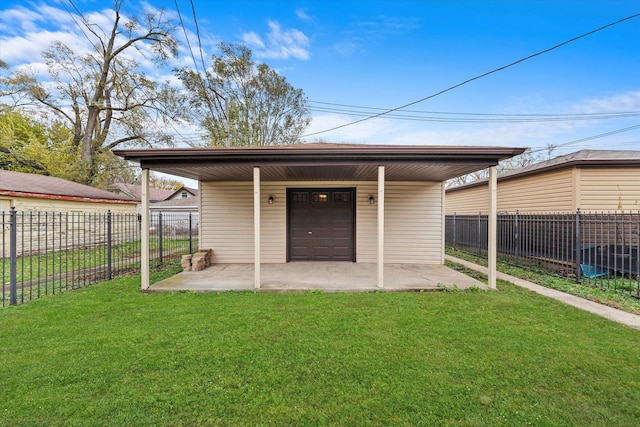 view of outbuilding with a garage and a yard