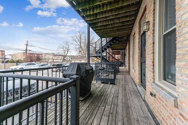 wooden deck featuring area for grilling