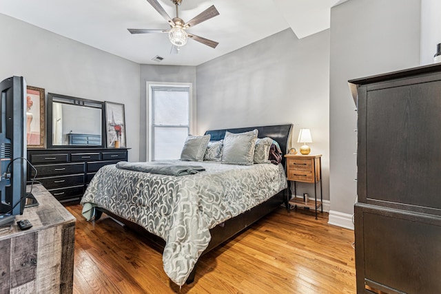 bedroom featuring ceiling fan and hardwood / wood-style floors