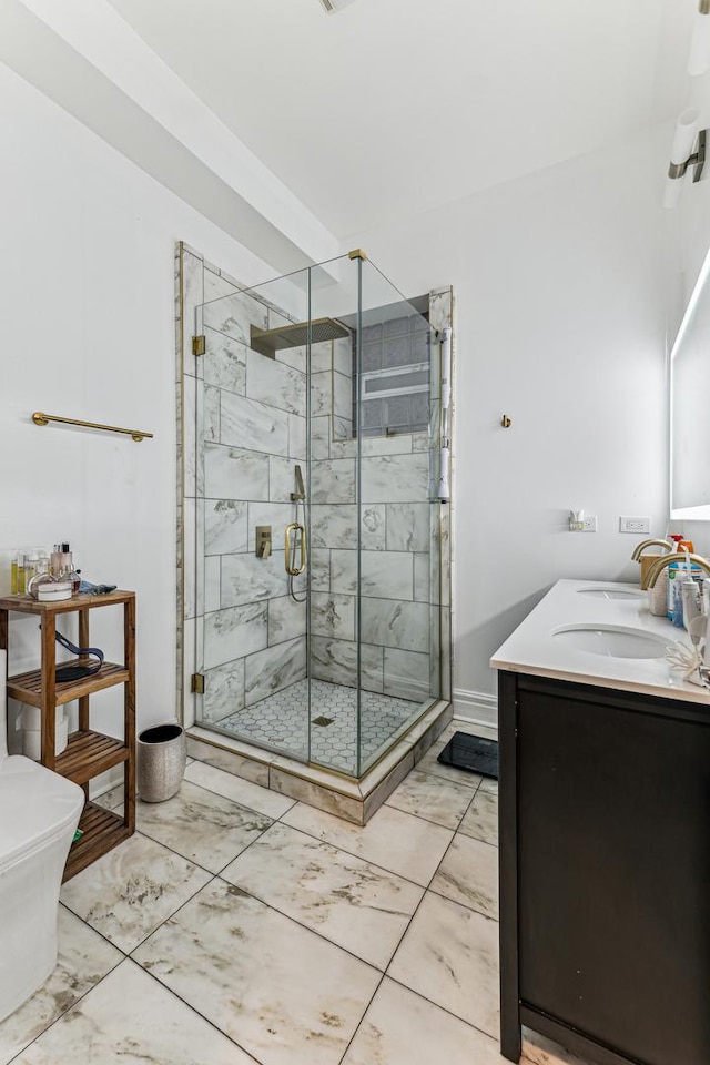 bathroom featuring vanity, toilet, and walk in shower