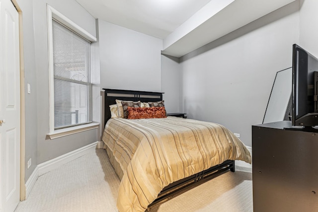 bedroom featuring light colored carpet