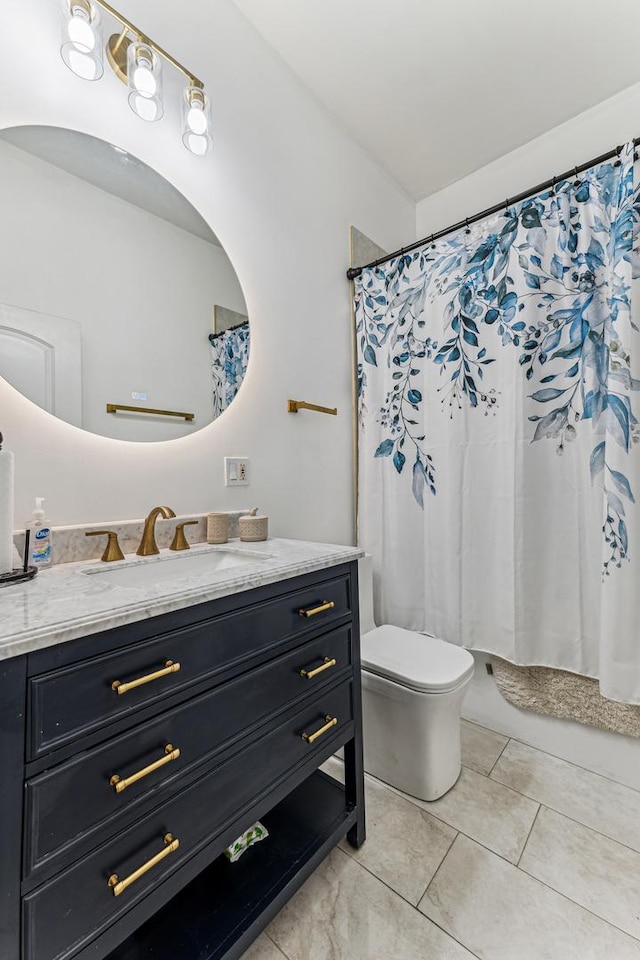 bathroom with a shower with curtain, tile patterned floors, toilet, and vanity