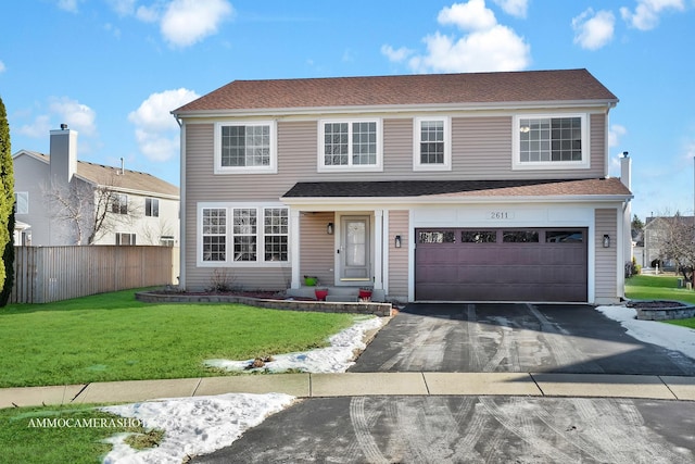 front facade with a garage and a front lawn