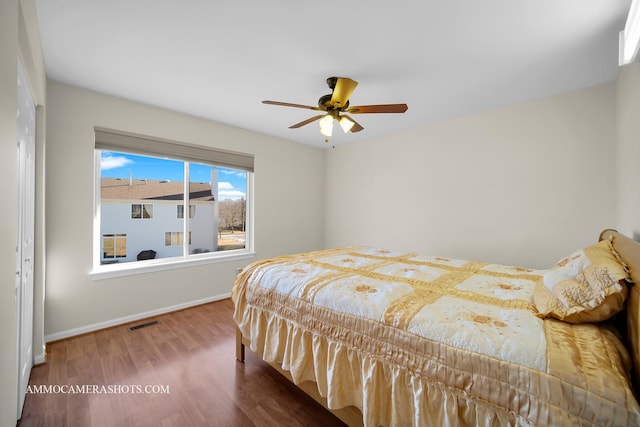 bedroom featuring hardwood / wood-style flooring and ceiling fan