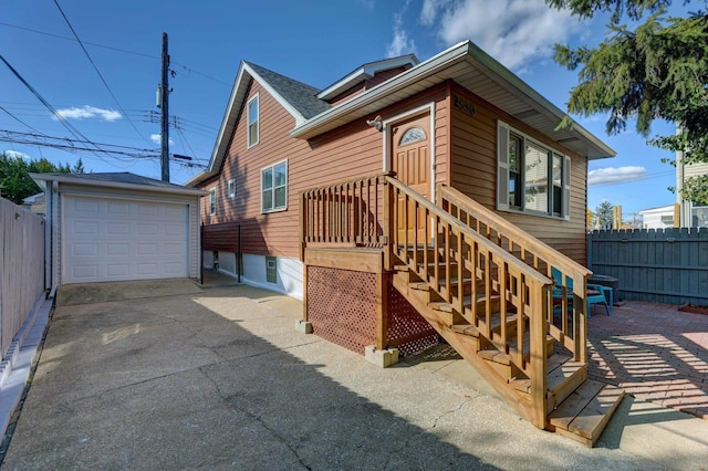 exterior space featuring a garage and an outdoor structure