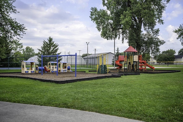 view of jungle gym featuring a lawn