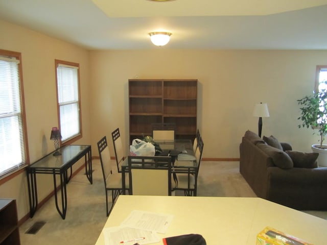 view of carpeted dining space