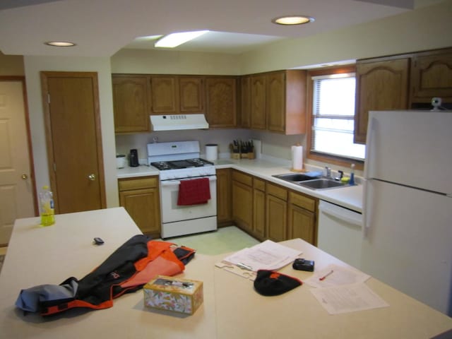 kitchen with sink and white appliances