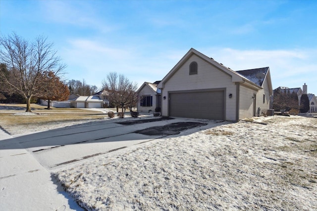 view of side of home featuring a garage