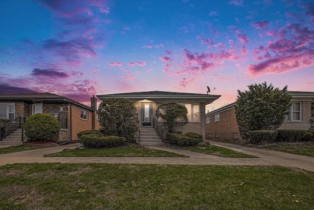 627 Paxton Ave, Calumet City, IL 60409 - view of front facade with brick siding and a front yard