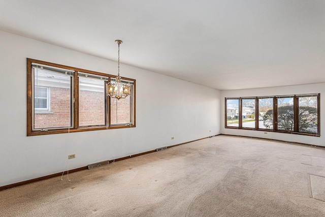 627 Paxton Ave, Calumet City, IL 60409 - spare room featuring baseboards, visible vents, carpet floors, and an inviting chandelier