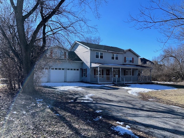 view of front of house featuring a garage and covered porch