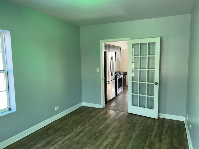 empty room featuring dark wood-type flooring