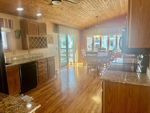 living room featuring a textured ceiling, a fireplace, and light hardwood / wood-style floors