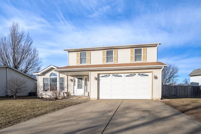 view of property featuring a porch, a garage, and a front lawn